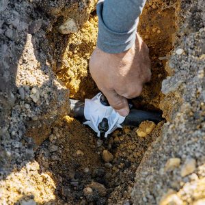 Lawn irrigation zone test during sprinkler system services in Northern Utah